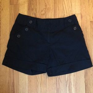 Courtenay black cuffed shorts with accent buttons
